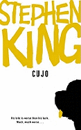 Cujo by Stephen King, a classic horror novel, displayed with its cover featuring a fierce dog illustration.